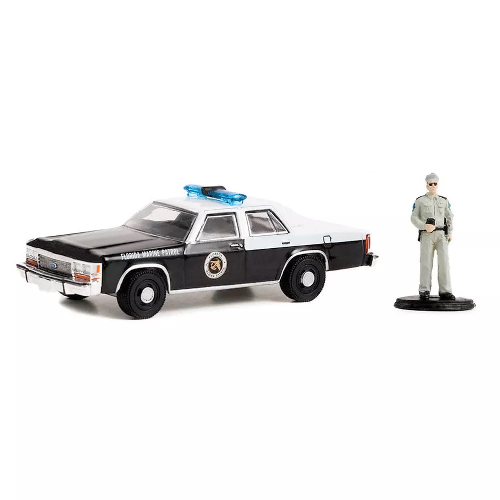 1990 Ford LTD Crown Victoria with Police Officer Series Hobby Shop - Greenlight - Scala 1/64