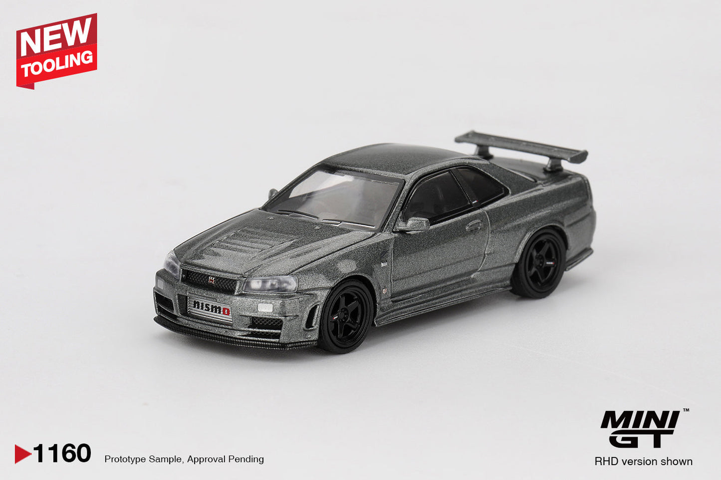 Mini GT - Nissan Skyline GT-R (R34) Dark Metal Gray Nismo CRS 1999 - Scala 1-64 MGT01160-BL Blister Packaging