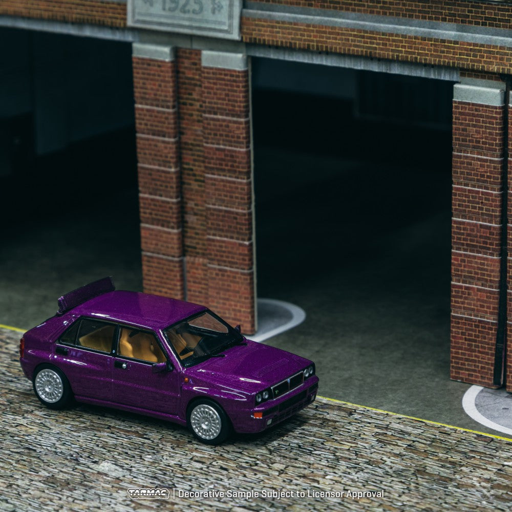 Lancia Delta HF Integrale Viola - Tarmac Works - Scala 1/64 T64R-TL049-VI
